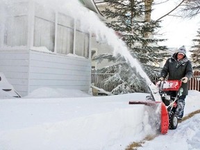 In this file photo, Vulcan resident Al Gorzitza uses a snowblower to clear his sidewalk. Vulcan's Community Peace Officer Loreli Hornby has started a program called A Helping Hand to find volunteers who are willing to help residents who physically cannot shovel snow or afford to pay someone to do it.