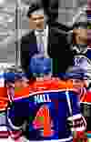 Edmonton head coach Dallas Eakins barks orders to his troops during an NHL game between the Edmonton Oilers and the Anaheim Ducks at Rexall Place in Edmonton, Alta., on Friday, March 28, 2014. The Oilers won 4-3 in overtime. Ian Kucerak/Edmonton Sun/QMI Agency