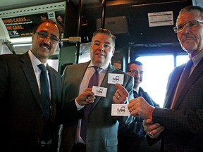 Left to right,  Councillors Amarjeet Sohi. Dave Loken, and Bryan Anderson helped launch the Edmonton Sun sponsored DONATE A RIDE  at City Hall on Monday Dec 15, 2014. DONATE A RIDE funds are used to purchase transit tickets which are distributed to local social service agencies. The agencies ten provide the transit tickets to low-income Edmonton families that are in need of basic transportation to get to employment, educational and social services. Claire Theobald/Edmonton Sun