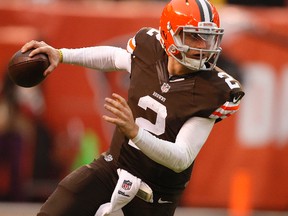 Cleveland Browns quarterback Johnny Manziel rolls out during NFL action against the Cincinnati Bengals at FirstEnergy Stadium. (Joe Maiorana/USA TODAY Sports)