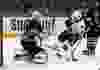 Dec 15, 2014; Buffalo, NY, USA; Buffalo Sabres goalie Jhonas Enroth (1) makes a save on Ottawa Senators left wing Clarke MacArthur (16) during the first period at First Niagara Center. Mandatory Credit: Timothy T. Ludwig-USA TODAY Sports