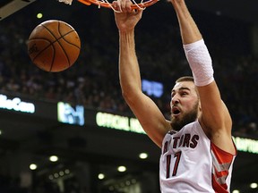 Jonas Valanciunas of the Toronto Raptors slams the ball during a game against the Denver Nuggets at the Air Canada Centre  in Toronto on Dec. 8, 2014. (CRAIG ROBERTSON/Toronto Sun)