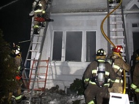 Firefighters battle the flames in a home being renovated at 140 Howick St. in Ottawa's Rockcliffe neighbourhood on Monday night. There were no injuries, but the home was gutted. (OTTAWA FIRE DEP'T submitted photo)