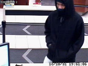 Ottawa cops are seeking this man in connection with a bank robbery at a Towngate shopping centre branch on Oct. 31, 2014. (OTTAWA POLICE Submitted image)