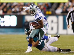 Dallas Cowboys running back DeMarco Murray (29) carries the ball as Philadelphia Eagles linebacker Brandon Graham (55) defends in the first quarter at Lincoln Financial Field. (Bill Streicher-USA TODAY Sports)