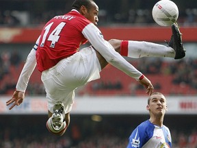 Arsenal's Thierry Henry controls the ball as David Bentley of Blackburn Rovers looks on during their FA Cup fifth round match at the Emirates Stadium in London February 17, 2007.