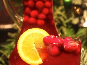 Frozen cranberries act as the ice cubes in this delicious cranberry ginger holiday punch.