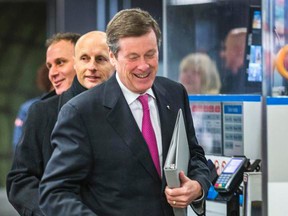 Mayor John Tory, foregroud, Councillor Josh Colle and TTC CEO Andy Byford at Victoria Park Station on Tuesday, Dec. 16, 2014. (ERNEST DOROSZUK/Toronto Sun)