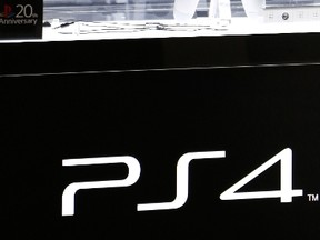 Sony Computer Entertainment's PlayStation 4 20th Anniversary Edition video game console is displayed at Sony's showroom in Tokyo on December 4, 2014. (AFP PHOTO/Yoshikazu Tsuno)