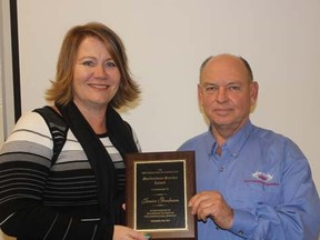 Chatham-Kent businesswoman Janice Goodreau was recently presented with the KFA's Meritorious Service Award. Making the presentation of the KFA's annual meeting is past-president Louis Roesch.