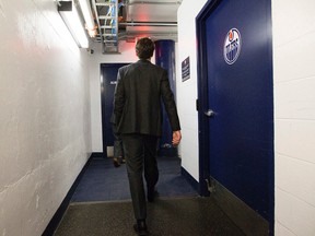 Former Edmonton Oilers head coach Dallas Eakins leaves a press conference after speaking to the media at Rexall Place, in Edmonton Alta., on Tuesday Dec. 16, 2014. Eakins was fired by the Oilers on Dec. 15, 2014. David Bloom/Edmonton Sun/QMI Agency
