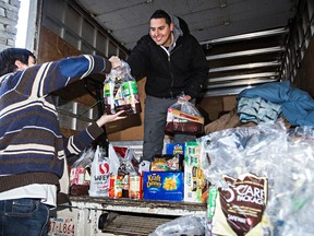 Dan Johnstone collects Food Bank donations at the Safeway in Southgate Centre recently.