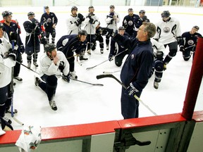 Craig MacTavish, shown here in 2007 during his first stint as coach with the team, took to the ice with the team in Arizona during Tuesday's morning skate. (Edmonton Sun file)