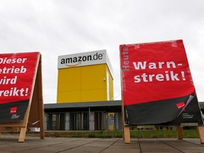 Verdi union placards reading, "Warning strike" are placed in front of the Amazon logistics centre in Graben near Augsburg Dec. 15, 2014.  REUTERS/Michaela Rehle