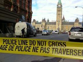 Police block off access to Parliament Hill after shots were fired in Ottawa, Ont., on Oct. 22, 2014. (Matt Usherwood/QMI Agency)