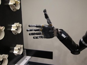 A woman with quadriplegia picked up objects, grasped them and placed them using the robotic hand, according to the latest report in the Journal of Neural Engineering. (Photo: Journal of Neural Engineering/IOP Publishing)