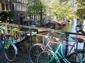 Pedal your way around town to take in copious canal views. (Rick Steves Photo)