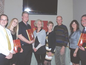 At the launch for the book One Hundred Years One Hundred Families at the Arts and Cookery Bank last week were left, Bill  Denning, West Elgin Secondary School students Sarah deWit and Twan Dieker, Sheri Somerville, Grace McGartland, Jerry Galbraith, Tammy Oliveira and Steve Peters.