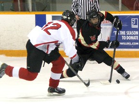 Jason Braun of the Northern Vikings slams on the brakes as he tries to keep the puck away from Brendan Smith of the Lambton Central Lancers during high school boys hockey at Clearwater Arena in Sarnia. The Vikings scored three late goals in a 4-4 draw. (TERRY BRIDGE, The Observer)