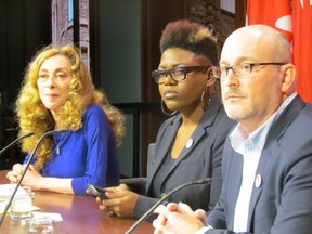 From left, Valerie Scott, of Sex Professionals of Canada (SPOC), Akio Maroon, of Maggie's Toronto, and Richard Elliott, of ​Canadian HIV/AIDS Legal Network, call on the country's premiers to refuse enforcement of Bill C-36 at Queen's Park on Wednesday, December 17 2014. (Toronto Sun/Antonella Artuso)