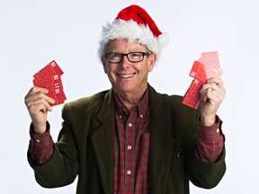 Graham Hicks with gift cards for Adopt-A-Teen.
