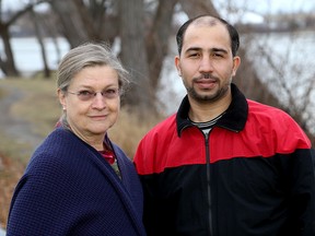 Rev. Dawn Clarke, left, and Yaser Al Mtawa are helping to bring a Syrian refugee family to Kingston. (Ian MacAlpine/The Whig-Standard)