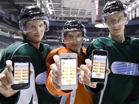 London Knights Ben Gleason, Kevin Klima and Tyler Nother show their smartphones displaying an app that allows the players to watch videos of their shifts. The digital program also contains the players? daily schedules, plus contact information for everyone in the organization. (DEREK RUTTAN, The London Free Press)