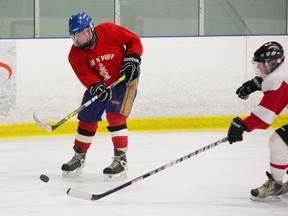 Jan Loos (left) is set to enter the Guiness Book of World Records as the oldest man to play in a competitive hockey game at age 85 on Friday. The defenceman was photographed in London, Ont., on Wednesday, Dec. 17, 2014. (Derek Ruttan/QMI Agency)