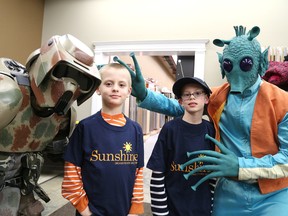 Gino Donato/The Sudbury Star
James Butcher, second from right, and his twin brother Michael, pose with some Star Wars charaters that were on hand for his Sunshine Foundation dream at the End of the Roll on Wednesday night.