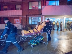 One man is dead, and several other people were hospitalized, following the two-alarm blaze at 245 Dunn Ave. (VICTOR BIRO/Special to the Toronto Sun)