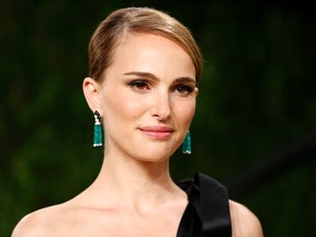 Natalie Portman arrives at the 2013 Vanity Fair Oscars Party in West Hollywood, California in this February 24, 2013 file photo. REUTERS/Danny Moloshok/Files
