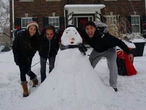 Lambton College international students discover the Canadian phenomenon of snowmen. The college is currently looking for host families in Sarnia for an upcoming program that begins in January 2015. 
submitted photo for SARNIA THIS WEEK/QMI AGENCY