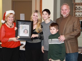 Celebration of Lights recognized the tireless efforts of one of its most dedicated volunteers, the late Ted Arnold, during its Dec. 17 annual awards ceremony. Accepting the award on his behalf is his daughter Meredith. From left to right: Cathie Blake, Meredith Musial, Tim Croxon, Evan Lewandowski, Mitchell Musial. (CARL HNATYSHYN /QMI AGENCY)