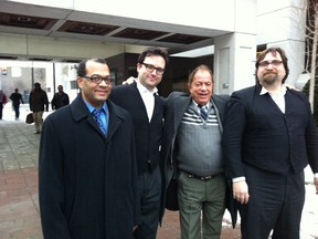 Demetrios Angelis, left, smiles while father Theodore, second from the right, grins hugely after Demetrios Angelis' acquittal Thursday of the second-degree murder of his wife in 2008. Lawyers Oliver Abergel, far right, and Howard Krongold, second left, secured the jury's not guilty verdict after a hard-fought trial. (TONY SPEARS/Ottawa Sun/QMI Agency)