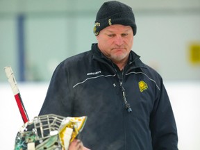 Knights head coach Dale Hunter talks to a steaming Michael Giugovaz after a goalie drill during their practice at the Western Fair Sports Centre in London on Thursday. Mike Hensen/The London Free Press/QMI Agency