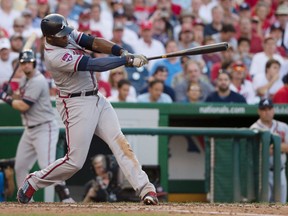 Atlanta Braves outfielder Justin Upton hits a two-run double during MLB play against the Washington Nationals at Nationals Park. (Tommy Gilligan/USA TODAY Sports)