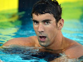 Michael Phelps reacts after placing seventh in the 100-metre freestyle in the 2014 USA National Championships in Irvine, California, in this file photo taken August 6, 2014. (REUTERS/Kirby Lee-USA TODAY Sports/Files)