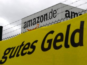 Verdi union placard reading "good money" is placed in front of the Amazon logistics centre in Graben near Augsburg Dec. 15, 2014.  REUTERS/Michaela Rehle