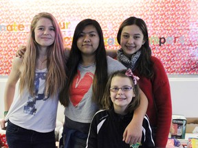 From left to right: Kendra Hanna (Grade 9), Leuie Reyes (Grade 8), Aurora April (front, Grade 4) and Cheyanne Shanmugam (Grade 6) were four of the Ecole Meridian Heights School students who were part of the Stony Plain Christmas music video. - Karen Haynes, Reporter/Examiner