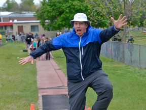 Henry VanAsseldonk hams it up in the long jump pit during the May 2014 TVDSB track and field meet at Annandale School, evidence of the 'great sense of humour' noted by Annandale students Rhiannon Bramburger and Hailey McIntee in their farewell column.
(CHRIS ABBOTT/TILLSONBURG NEWS)