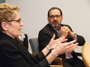 Ontario Premier Kathleen Wynne makes a point as Sudbury MP Glenn Thibeault looks on during an editorial meeting with The Sudbury Star on Friday. Thibeault was recently named as the Liberal candidate for the Sudbury riding in the upcoming provincial byelection. JOHN LAPPA/THE SUDBURY STAR/QMI AGENCY