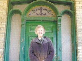 The late Julia Beck stands on the porch of 611 Talbot St., the earliest surviving triple-arch doorway in London. Beck was working on a book about those doorways when she died in 2012. Completed by her friends, the book has just been published. (Free Press file photo)
