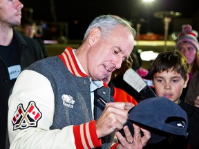 Ron MacLean signs autographs while in Selkirk, Man.., on Oct. 19 for Rogers Hometown Hockey. (Brook Jones/QMI Agency)