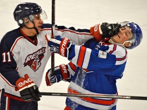 Scott Woloshyn of the Regals shows concern for the Flyers’ hygiene by offering one a face wash during Stony Plain's 4-1 win over Spruce Grove. - Mitch Goldenberg, Reporter/Examiner