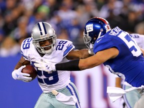 Dallas Cowboys running back DeMarco Murray (29) rushes against the New York Giants during the third quarter at MetLife Stadium on Nov 23, 2014 in East Rutherford, NJ, USA. (Adam Hunger/USA TODAY Sports)