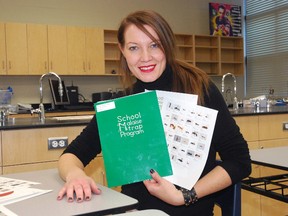 Central Elgin Collegiate Institute teacher Tanya Dyke holds literature from the Malaise Trap Program, which her Grade 9 science students used to gather insects for a DNA barcoding project. (Ben Forrest, Times-Journal)