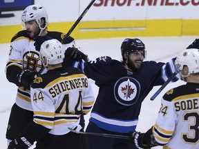 Mathieu Perrault celebrates Dustin Byfuglien's second-period goal against the Boston Bruins. (KEVIN KING/Winnipeg Sun)