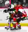 Ottawa Senators' Cody Ceci battles with Anaheim Ducks' Emerson Etem during NHL hockey action at the Canadian Tire Centre in Ottawa, Ontario on Friday December 19, 2014. Errol McGihon/Ottawa Sun/QMI Agency