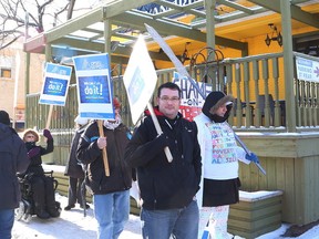 JOHN LAPPA/THE SUDBURY STAR
Members of OPSEU and the Sudbury Coalition Against Poverty participate in a protest outside Alexandria's Restaurant, where Premier Kathleen Wynne met with Sudbury MP Glenn Thibeault and local Liberal supporters on Friday.