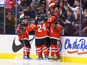 Team Canada celebrates Josh Morrissey's goal against Team Russia during a pre-tournament exhibition game ahead of the IIHF World Junior Hockey Championships at the Air Canada Centre on December 19, 2014. (Dave Abel/Toronto Sun/QMI Agency)